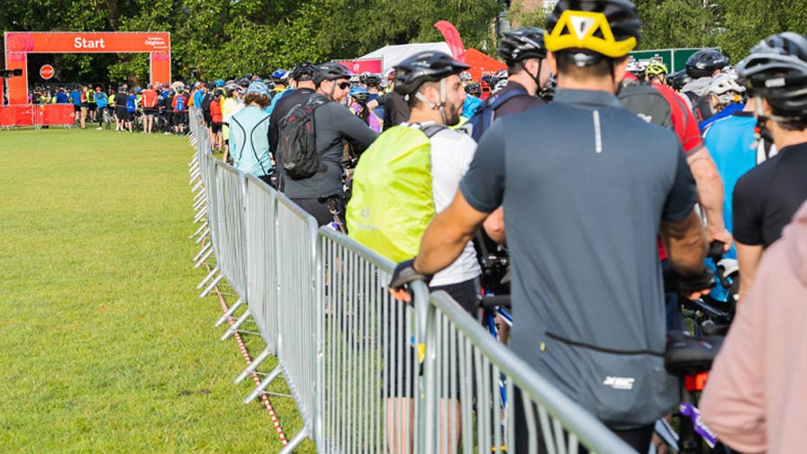 cyclists queue at the start line for the london to brighton bike ride