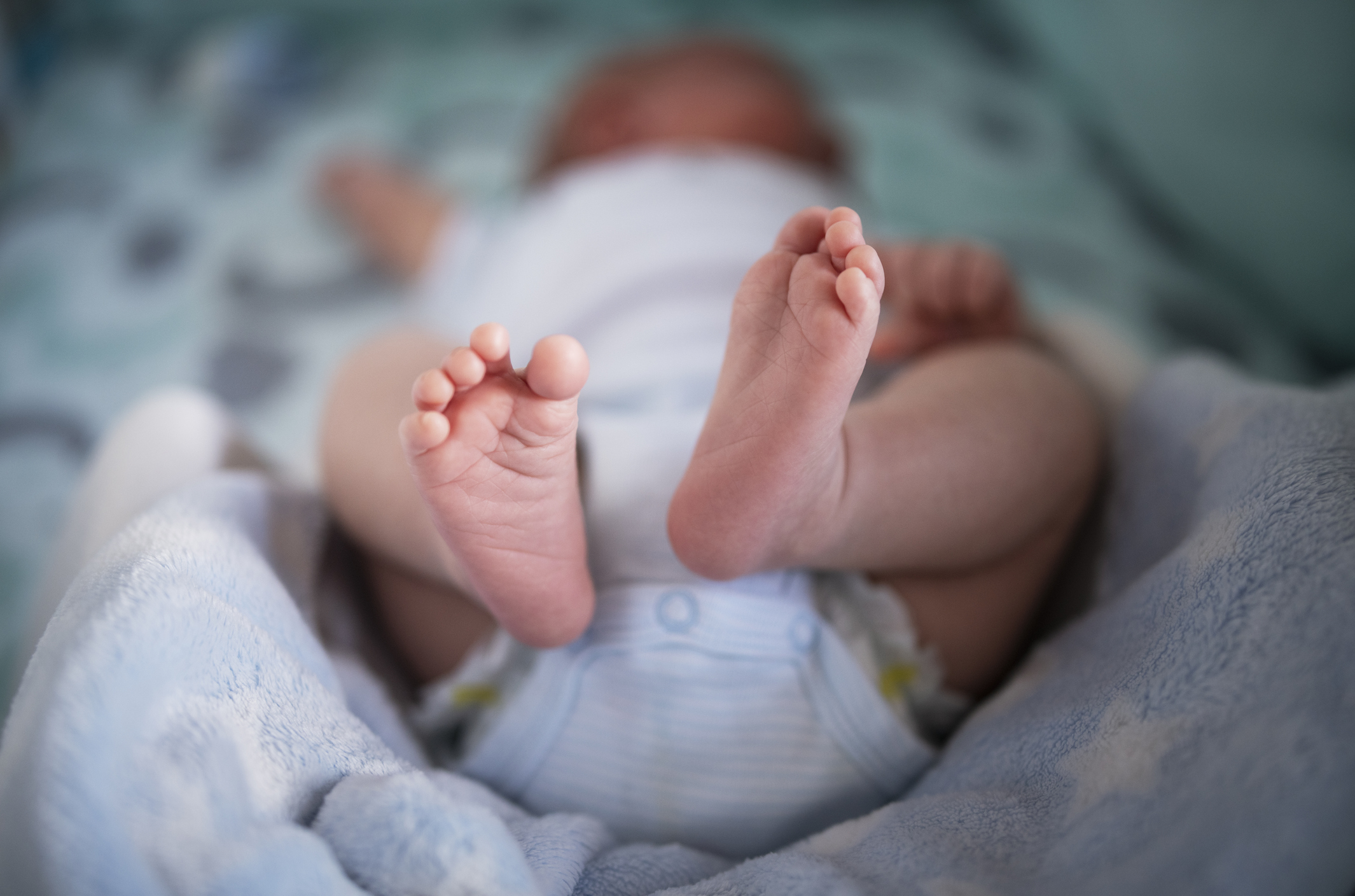Photo of a babies feet as they receive care