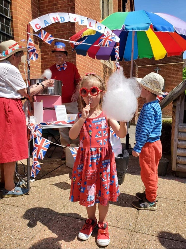 Girl eating candyfloss at Jubilee event