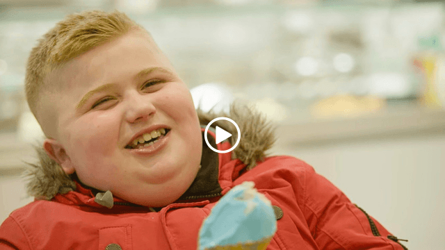 Digby laughing holding an ice cream 