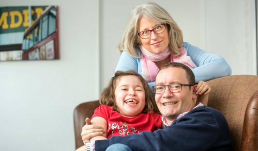 Lily pictured with her mum and dad