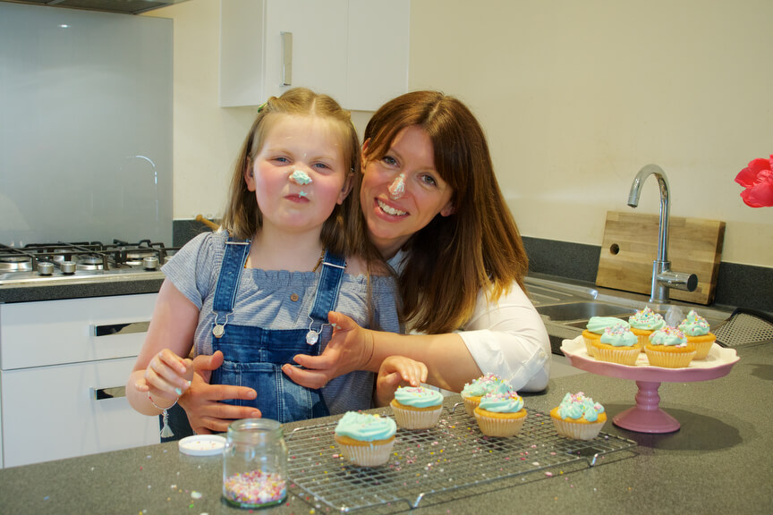Matilda baking cakes with her mum