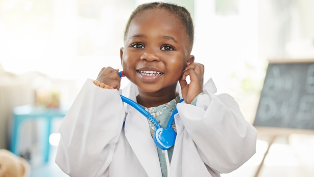 Child wearing a doctor outfit 