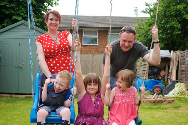 Tom and his family in the garden
