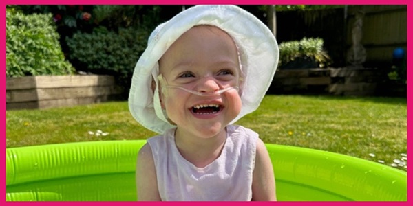 Elsie enjoying time in her paddling pool