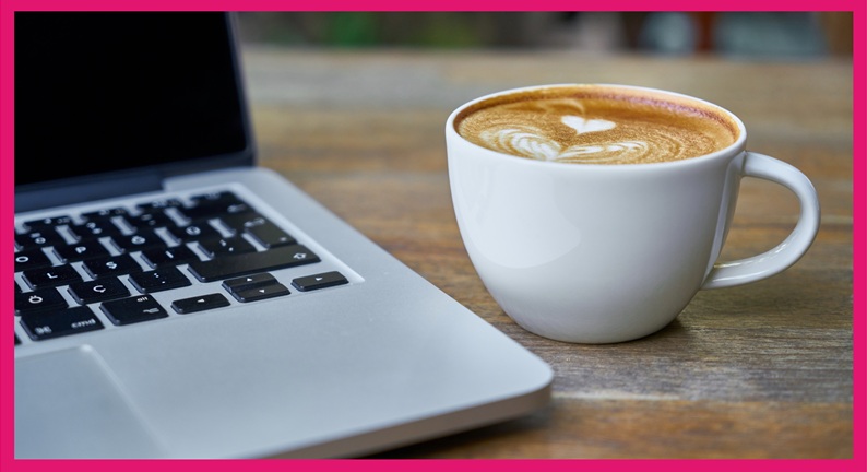 A laptop computer and coffee.