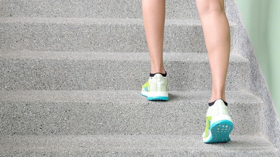 close up of feet climbing up stairs