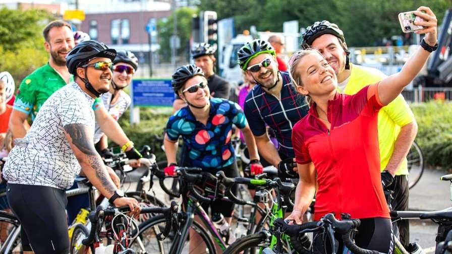 group of riders pose for selfie