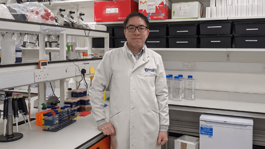 Professor Wyatt Yue in the lab