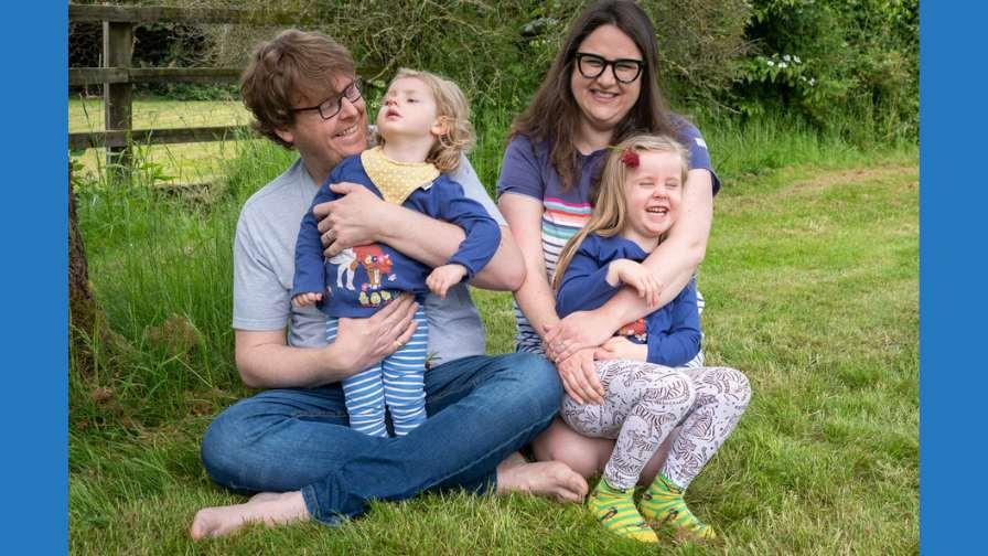 Image of Emmy and her family in the garden