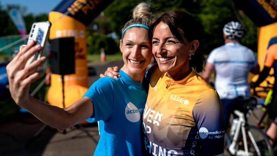 volunteer taking selfie with davina mccall