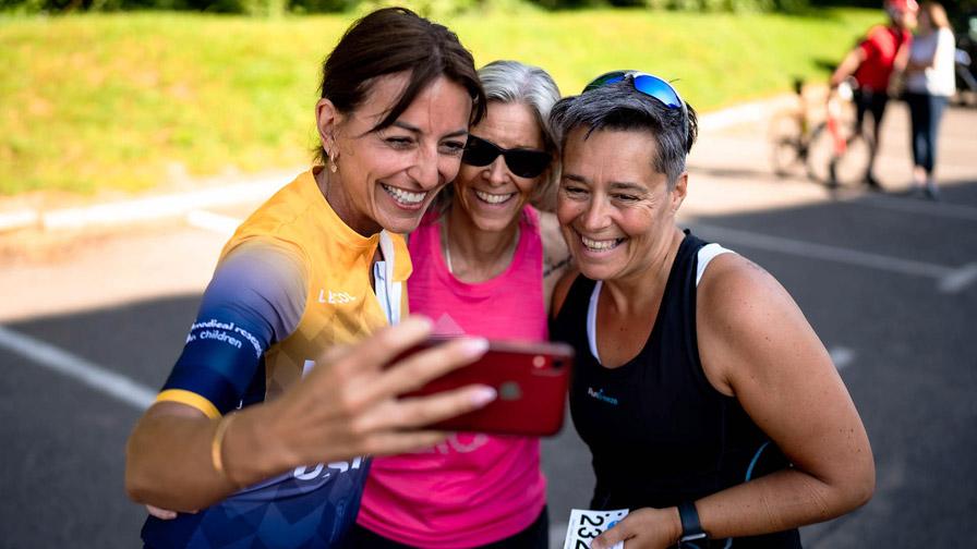 two participants taking selfie with davina mccall