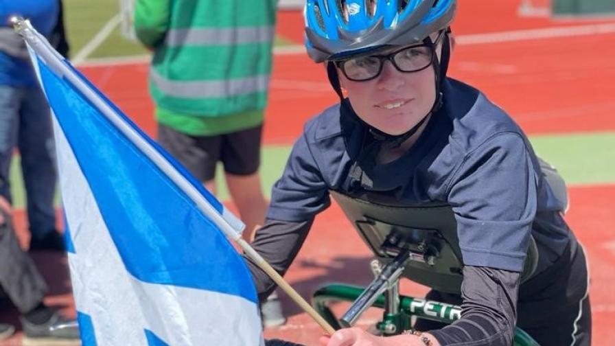 Ian with the Scotland flag at a Frame Running competition.