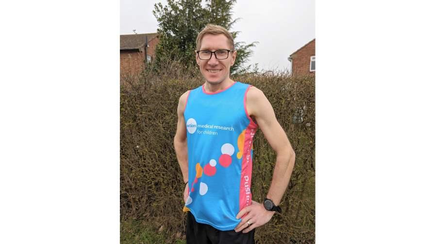 Image of Paul Scholes wearing a charity running vest