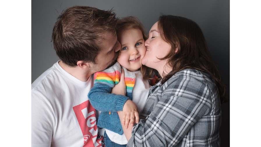 Image of Sophia with her parents