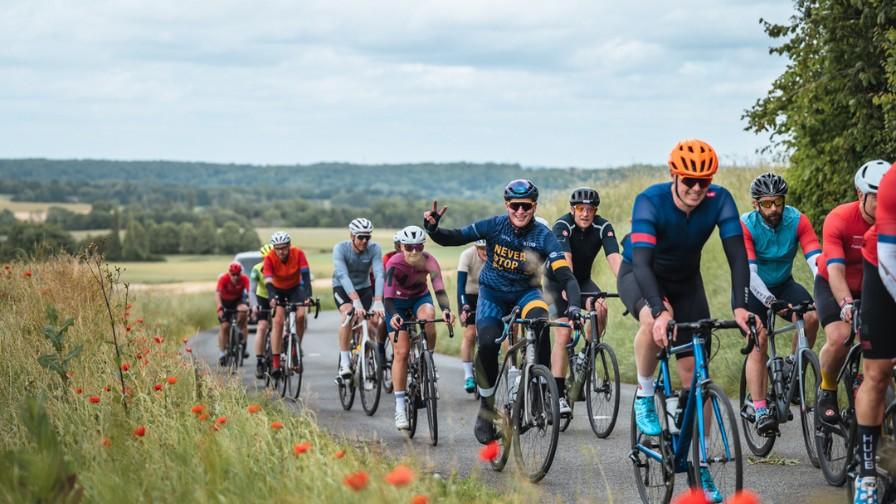 Riders going past poppy fields