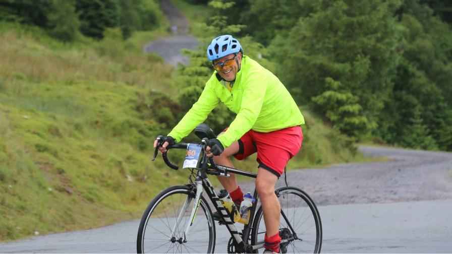 cyclist smiling as they pedal past