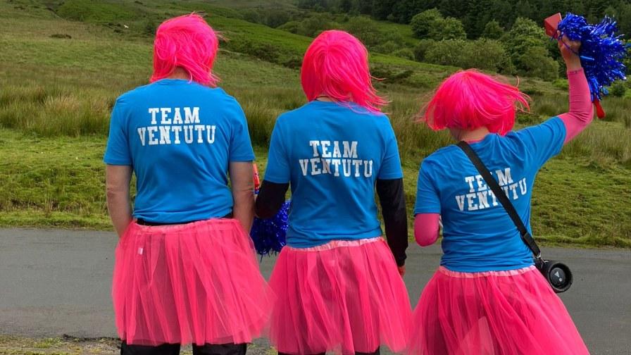 Supporters on the side cheering on teams