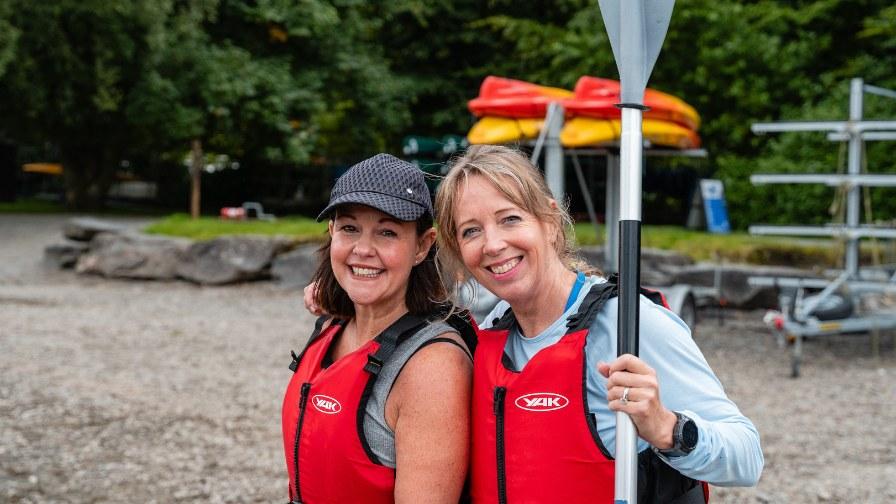 Participants holding a paddle