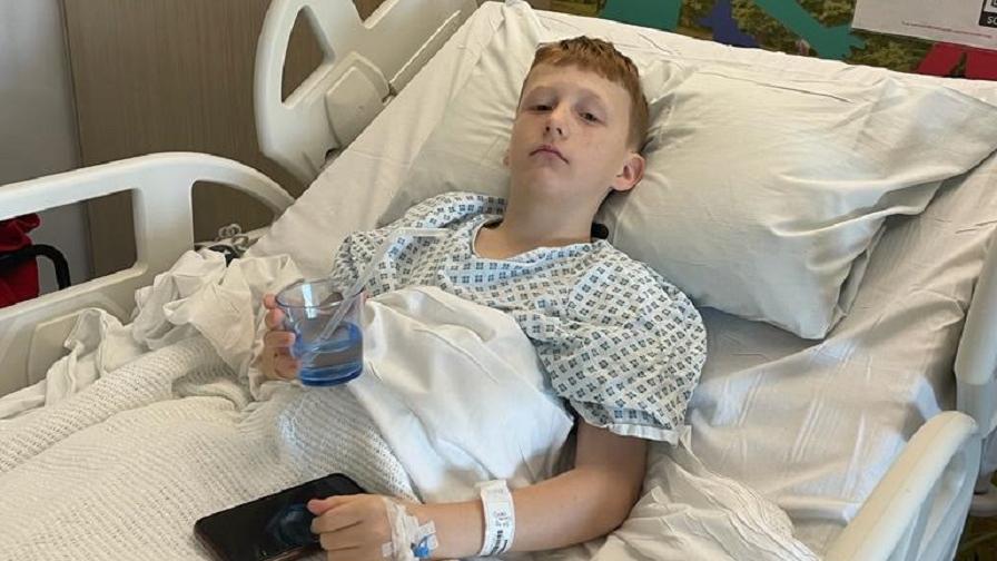 Oscar laying in a hospital bed.