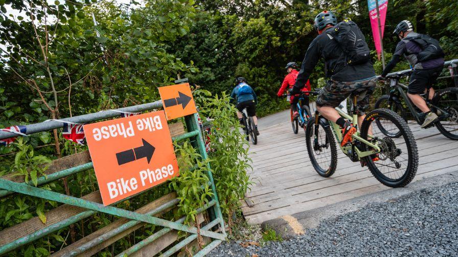 cyclists following signage