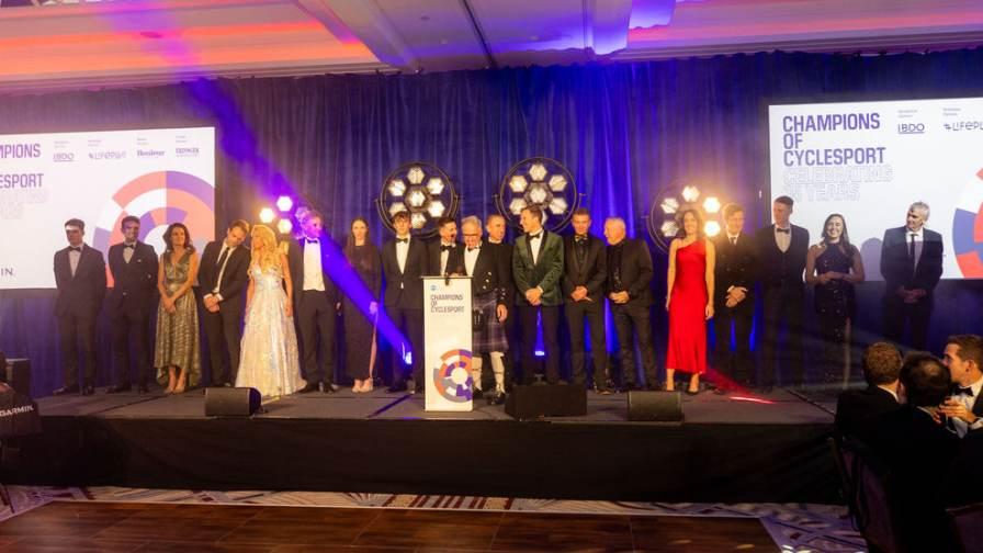 Images of cycling celebrities on stage at the Champs Dinner 2024