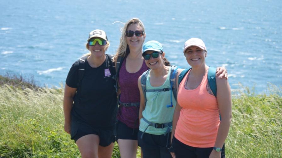 Group posing on clifftop