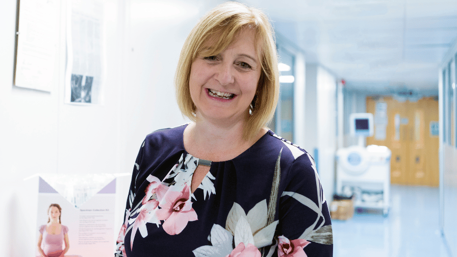 Professor Rachel Tribe in a hospital hallway smiling