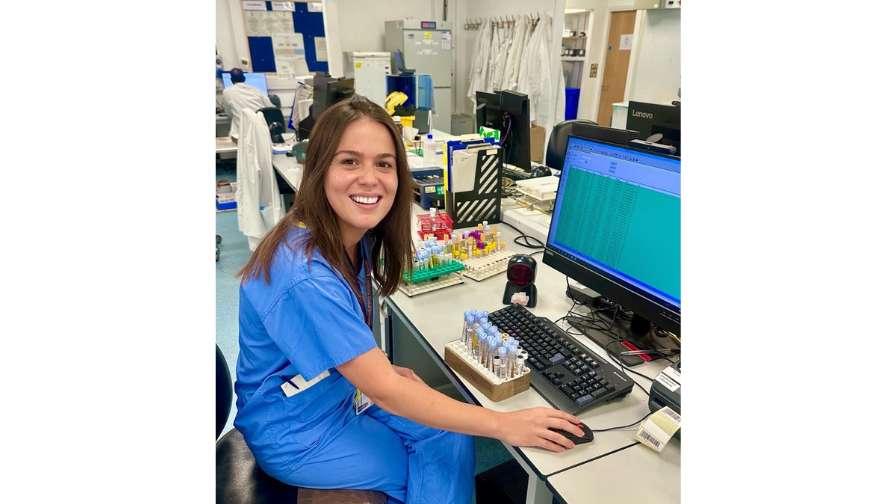 Image of Dr Eva at desk in the laboratory