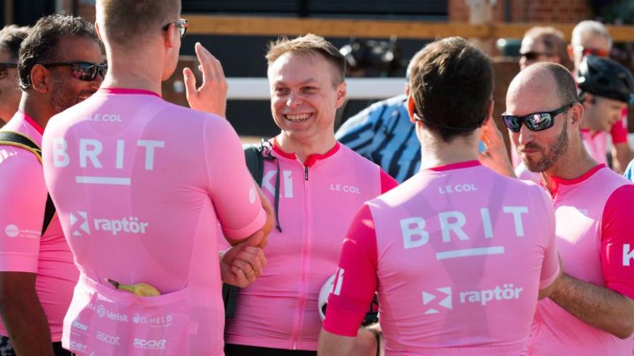 Cyclists in branded Raptor jerseys