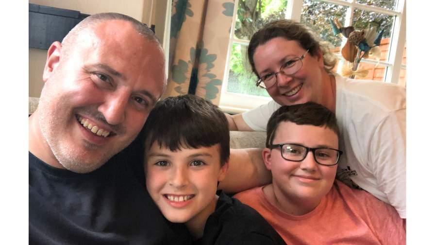 Image of the Webber family smiling