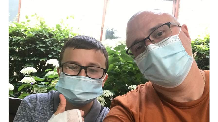 Image of Luke and his dad in masks