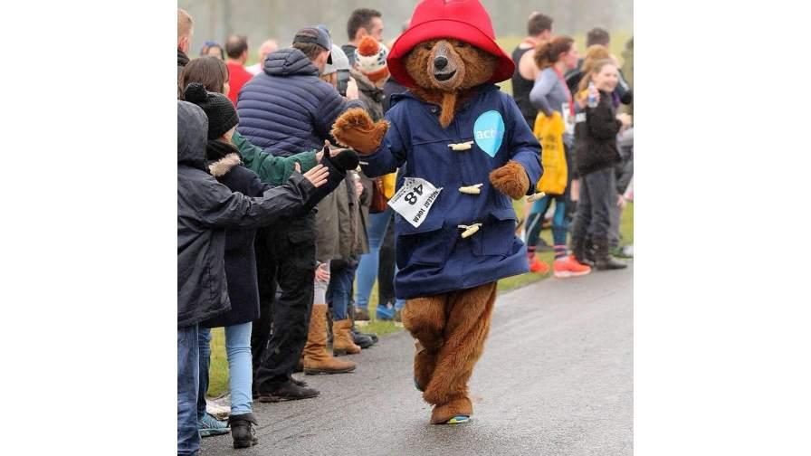 Image of Lee running the marathon dressed as Paddington bear