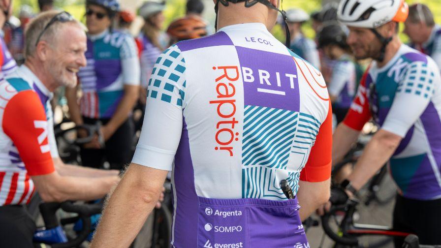 Cyclist in branded Raptor jersey