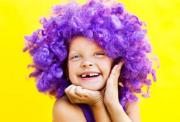 A child wearing a purple wig