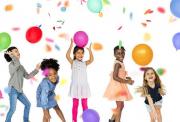 5 Chlidren playing with balloons and confetti in a party situation