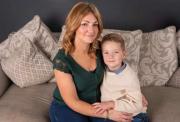 Henry and his mum Kayleigh on sofa at home
