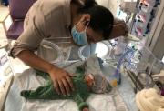 Zalena with her baby son Sam in hospital