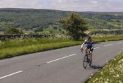 cyclist riding through the yorkshire dales