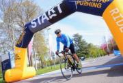 cyclist crossing the start line on ride wessex downs