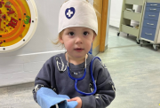 Eva dressed up as a doctor whilst in hospital