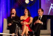 Cyclists Pfeiffer Georgi, Dani Rowe MBE and Alex Dowsett sat on a sofa on stage talking to the guests witha microphone
