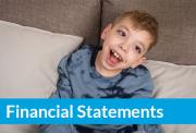 Smiling young boy in a blue tie-dye shirt sits on a couch with “Financial Statements” text in a bold blue banner across the bottom.