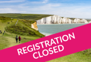 south downs way coastline with closed banner