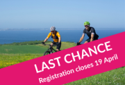 Two cyclists riding along a grassy ridge overlooking the sea. A pink diagonal banner across the foreground reads "LAST CHANCE" and "Registration closes 19 April."