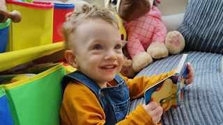 Image of Fletcher playing with books 