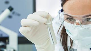 Female research running experiments in a lab