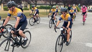 group of cyclists at the start of a ride