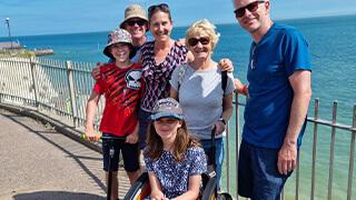 Naomi and family visiting the seaside 