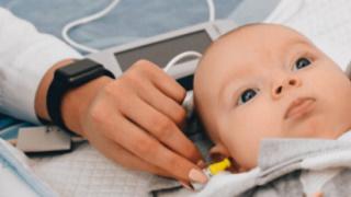 Newborn baby undergoing hearing test